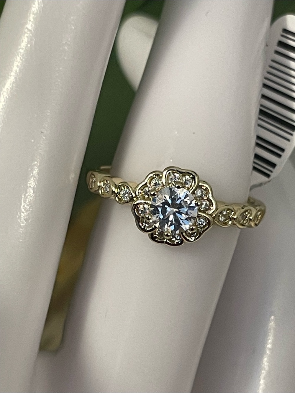Elegant Gold Floral Halo Solitaire Ring with White Center Stone